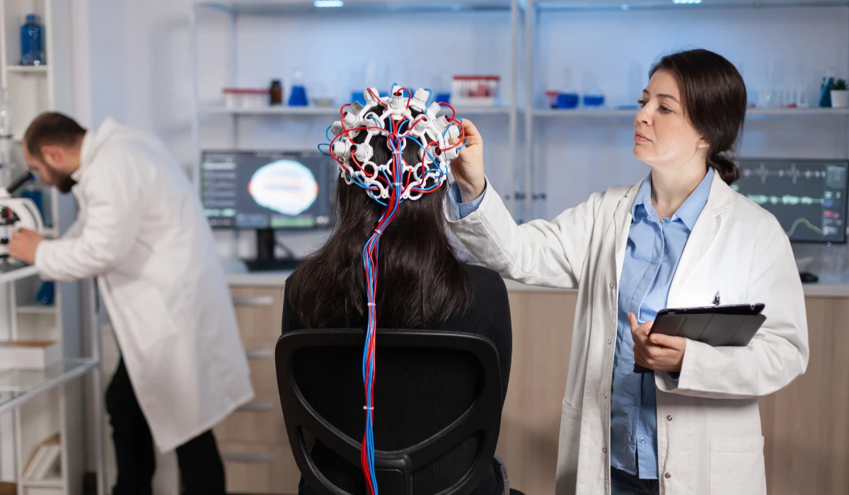 Woman Using Brain Monitoring Device