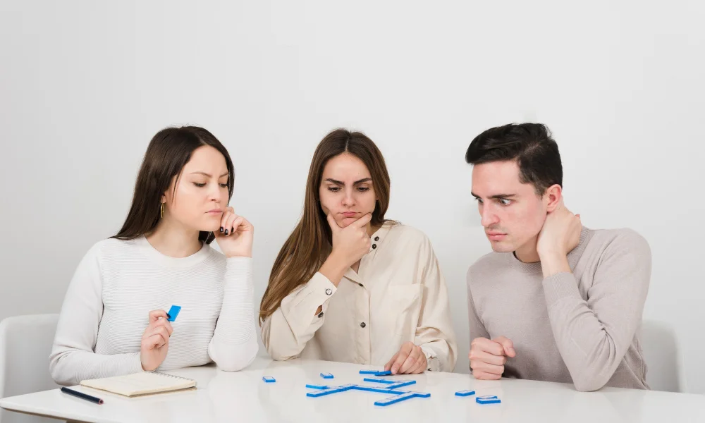 Three people sit at a table