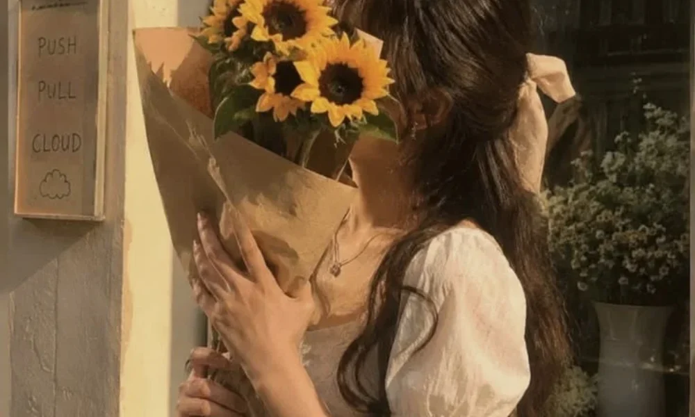  Cute girl holding fresh sunflowers for Unique Nicknames for Girls. 