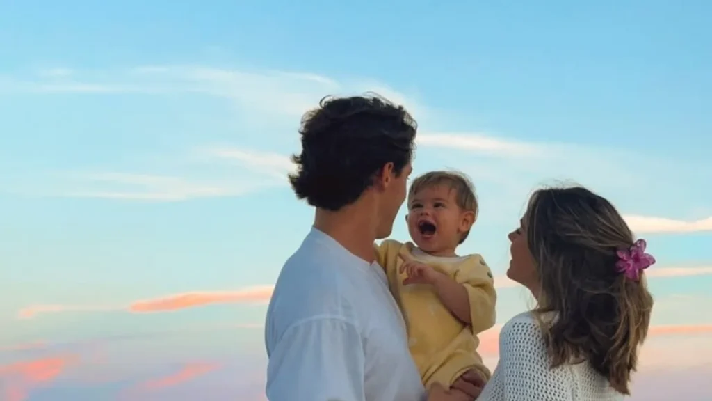 Parents enjoying time with their baby, featured in a guide on modern unisex names.